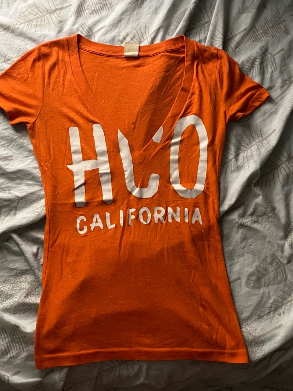Hollister Orange V-Neck Graphic Tee with White 'HCO California' Print